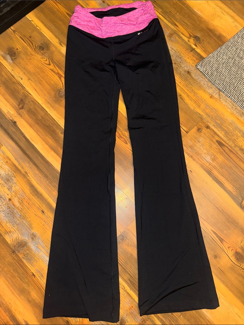 bebe Black Flare Yoga Pants with Pink Fold-Over Waistband